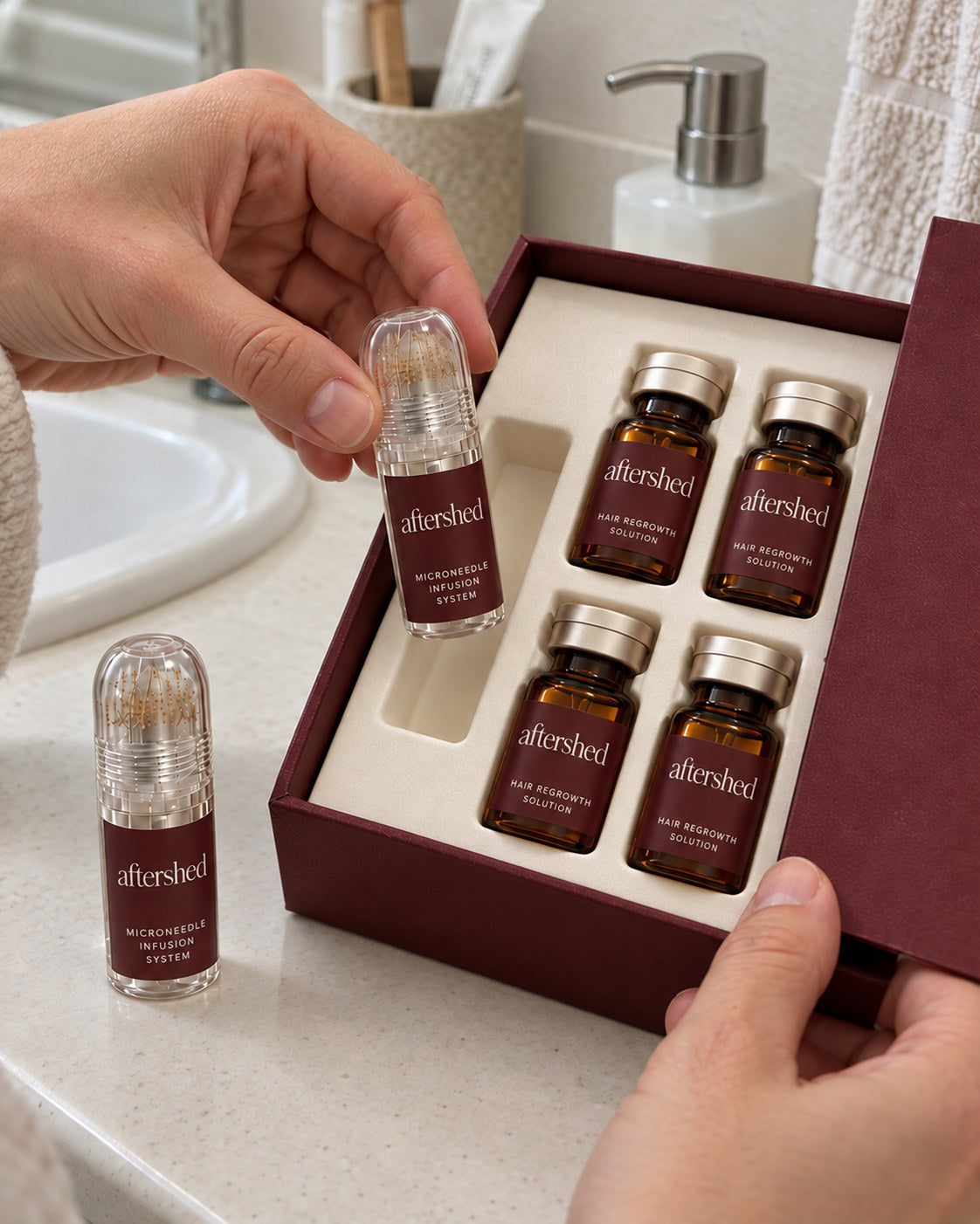 Hands lifting the stamp out of the AfterShed kit, with four serum vials inside